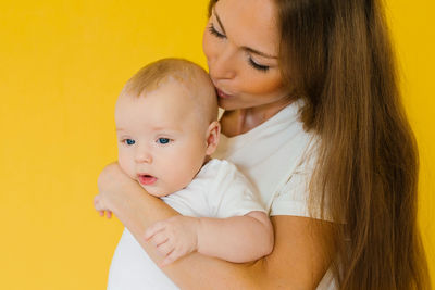 Loving mother takes care of a newborn baby, i think a portrait of a happy mother holding a sweet son