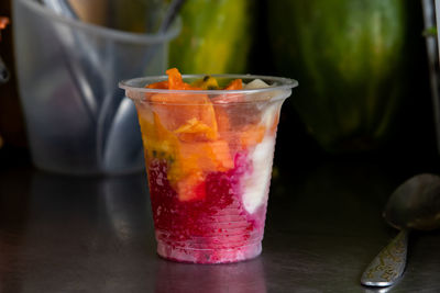 Preparation of a traditional sweet water ice with fruits called cholado in the city of cali colombia