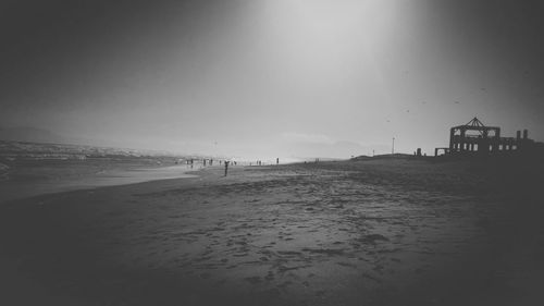 Scenic view of beach against clear sky