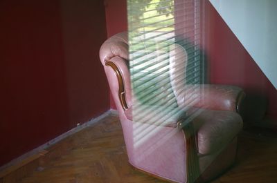 Close-up of human hand on wood at home