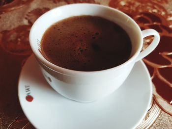 Close-up of coffee cup on table