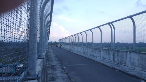 Bridge over road against sky