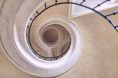 Directly below shot of spiral staircase in building