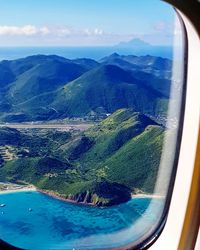 Aerial view of landscape seen through airplane window