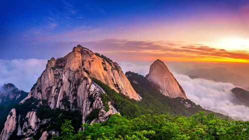 Scenic view of mountains against sky during sunset