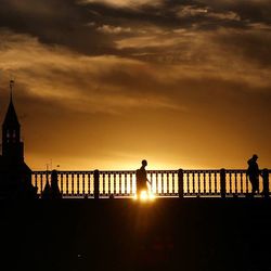 Silhouette of people at sunset