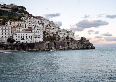 View of sea with buildings in background