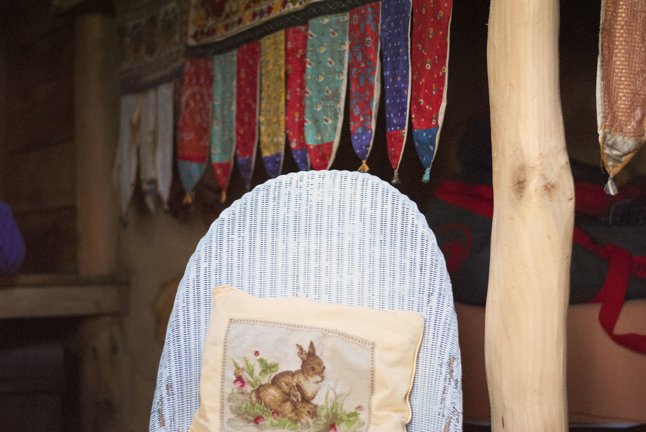 indoors, textile, no people, art and craft, focus on foreground, pattern, day, seat, creativity, close-up, nature, animal themes, hanging, table, plant, curtain, craft, home interior, still life, floral pattern