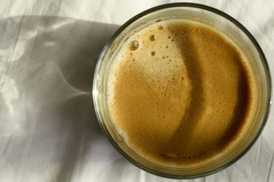 High angle view of coffee cup on table