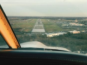 Aerial view of landscape seen through airplane window