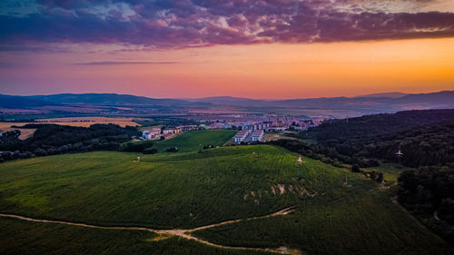 Scenic view of landscape against sky during sunset