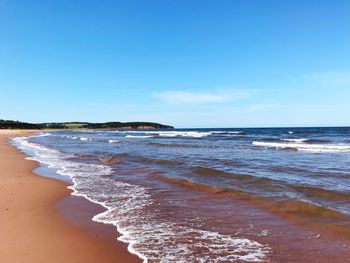 Scenic view of beach against sky