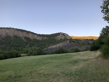 Scenic view of landscape against clear blue sky