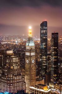 Illuminated buildings in city at night