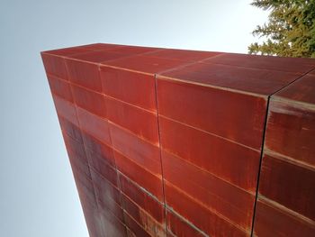 Low angle view of red building against clear sky
