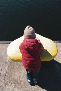 High angle view of woman standing in boat