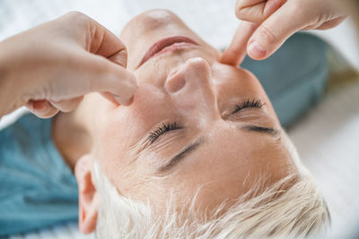 Close-up of woman getting massage at spa