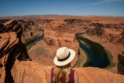 Rear view of woman on rock formation