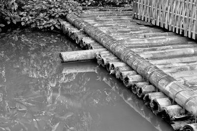 High angle view of bamboo footbridge over lake