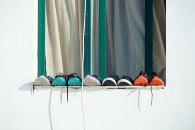 Row of umbrellas against blue wall