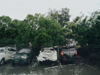 Wet car on road during rainy season