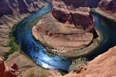 High angle shot of lake along rocky landscape