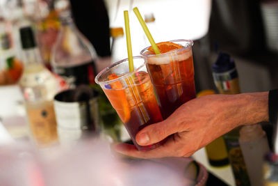 Close-up of hand holding drink