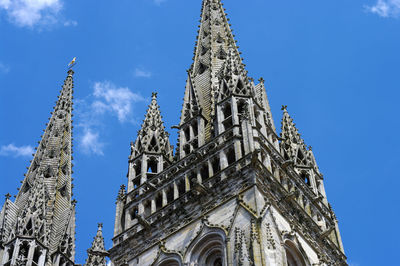 Low angle view of historical building against blue sky