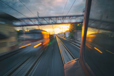 Blurred motion of train at railroad station platform