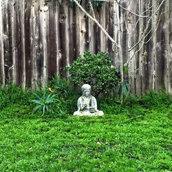 Statue of woman in park