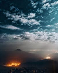 Scenic view of mountains against sky at sunset