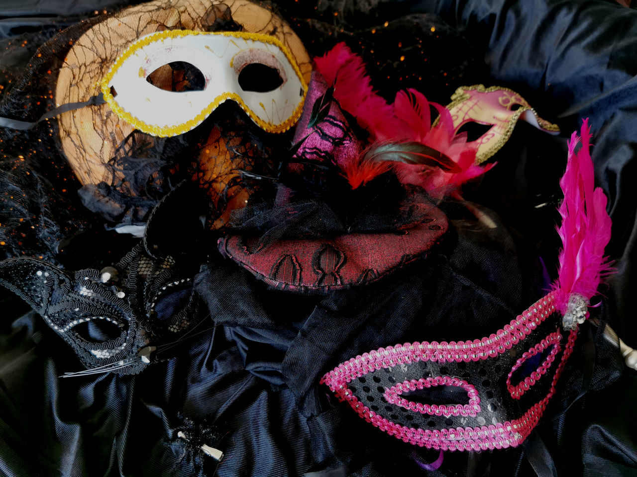 HIGH ANGLE VIEW OF VARIOUS MASK ON STREET