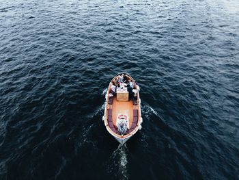 High angle view of people in boat on sea