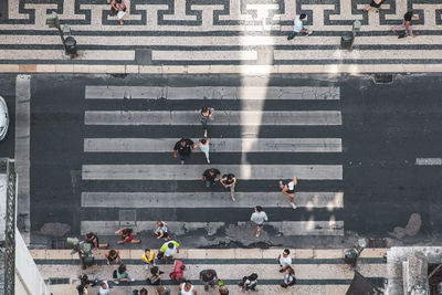 High angle view of people crossing road