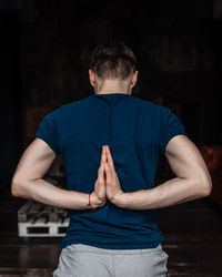 A man engaged in yoga and meditation, performing asanas