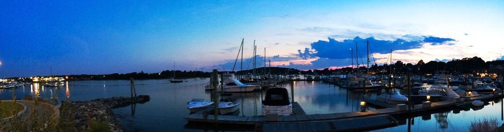 Boats moored at harbor