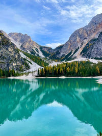 Scenic view of lake and mountains against sky