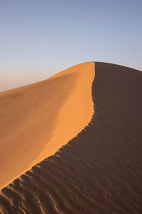 Scenic view of desert against clear sky