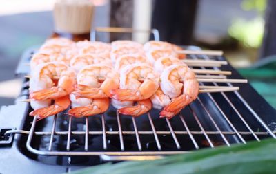 Close-up of meat on barbecue grill