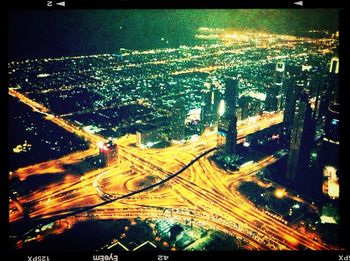 High angle view of illuminated cityscape at night