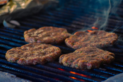 High angle view of meat on barbecue grill