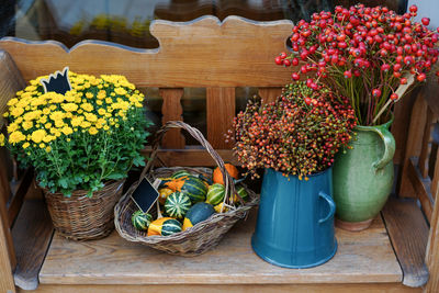 Autumn flowers and basket with pumpkins in flower shop. halloween and thanksgiving fall 