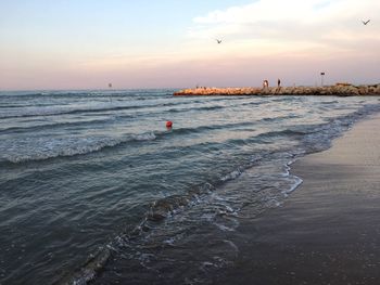 Scenic view of beach during sunset