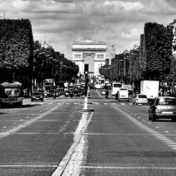 City street against cloudy sky