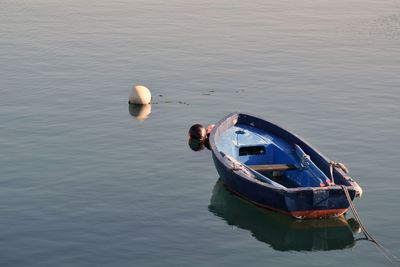 Boat moored in water
