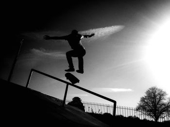 Low angle view of jumping jumping against clear sky