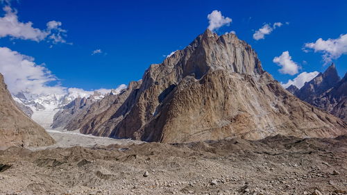 Low angle view of rock formations against sky