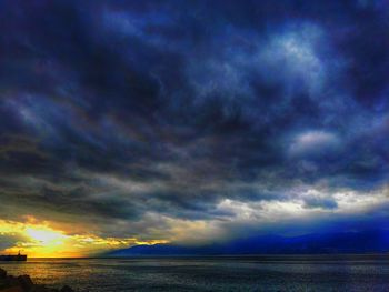 Scenic view of sea against cloudy sky