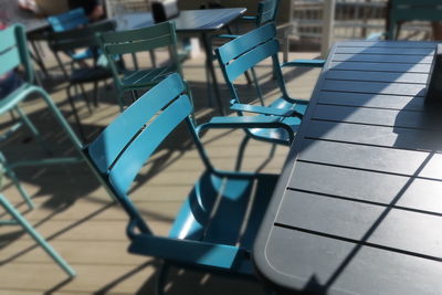 Close-up of chairs on table