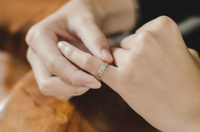 Close-up of woman holding ring